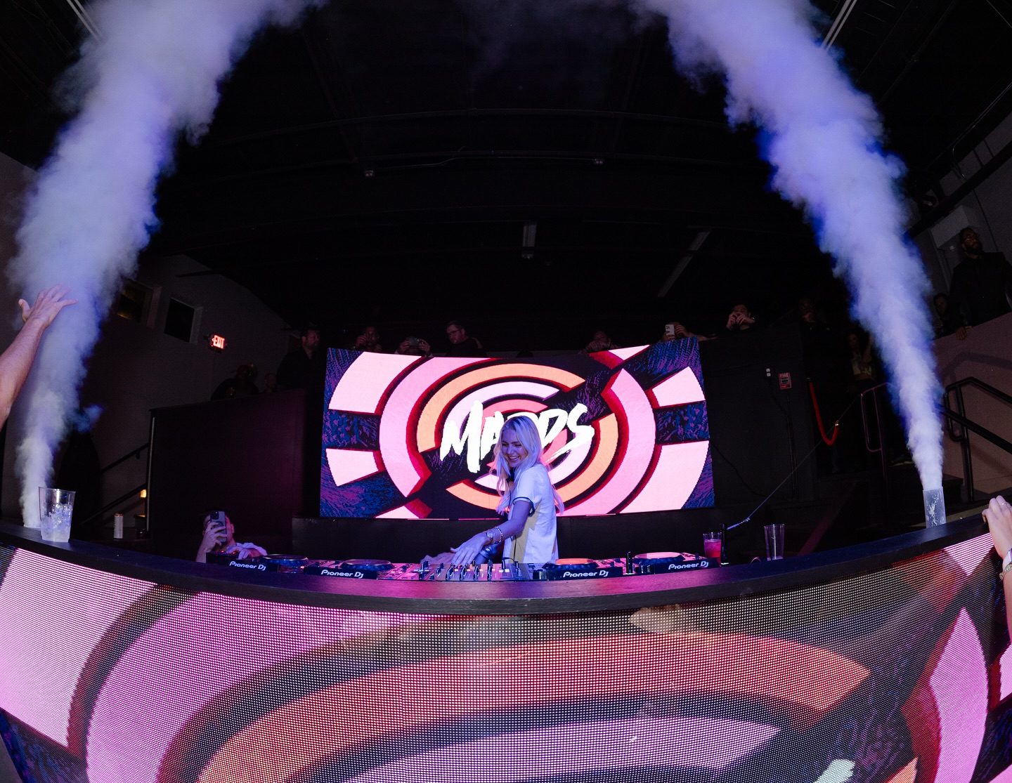 Curved LED wall behind the DJ booth at Medici in Rhode Island with fog effects